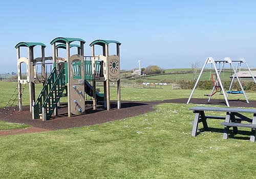 Photo Gallery Image - Climbing frame and swings at Week St Mary Parish Play Park